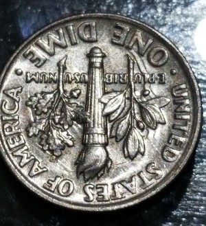 2009-P Roosevelt dime die clash error showing ghost reverse design elements on the obverse field